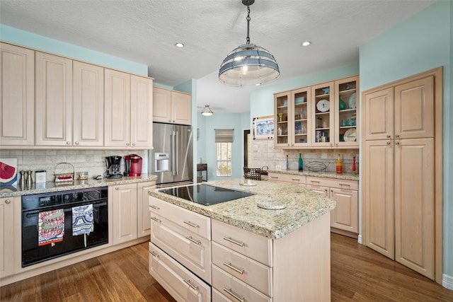 5123 W Bayshore Dr, Bacliff, TX 77518 - kitchen featuring black appliances, tasteful backsplash, dark wood-style floors, glass insert cabinets, and a kitchen island
