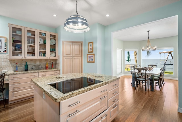5123 W Bayshore Dr, Bacliff, TX 77518 - kitchen featuring black electric cooktop, tasteful backsplash, glass insert cabinets, dark wood-style floors, and recessed lighting