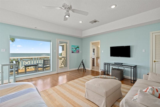 5123 W Bayshore Dr, Bacliff, TX 77518 - living room with wood finished floors, ceiling fan, recessed lighting, and baseboards