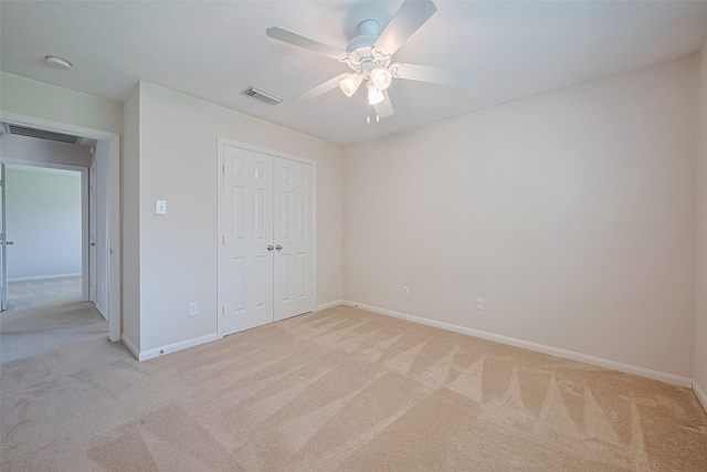 2311 Foster Leaf Ct, Richmond, TX 77406 - unfurnished bedroom featuring light carpet, a closet, and a ceiling fan