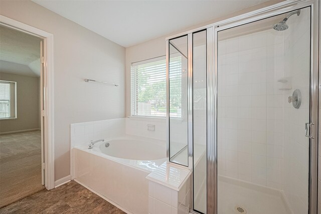 2311 Foster Leaf Ct, Richmond, TX 77406 - full bathroom featuring a shower stall, a garden tub, and healthy amount of natural light