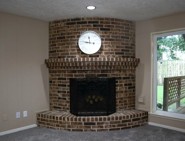 3135 Apple Dr, Missouri City, TX 77459 - detailed view of carpet flooring, a brick fireplace, and a textured ceiling