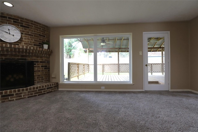 3135 Apple Dr, Missouri City, TX 77459 - unfurnished living room with plenty of natural light, carpet, and a brick fireplace