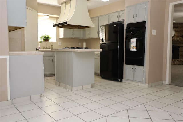 3135 Apple Dr, Missouri City, TX 77459 - kitchen with premium range hood, black appliances, a warming drawer, and light countertops