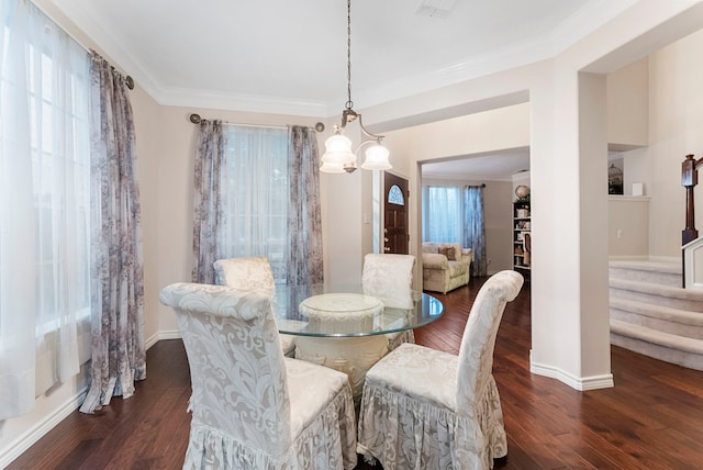 17131 Valley Palms Dr, Spring, TX 77379 - dining room featuring wood finished floors, crown molding, and a chandelier