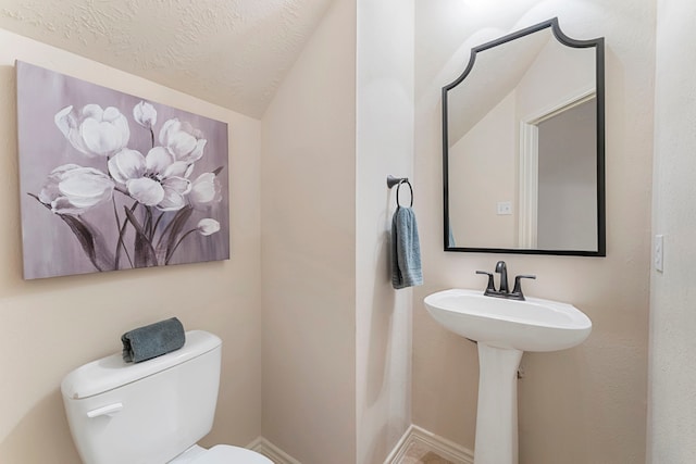 17131 Valley Palms Dr, Spring, TX 77379 - half bathroom featuring vaulted ceiling and a textured ceiling