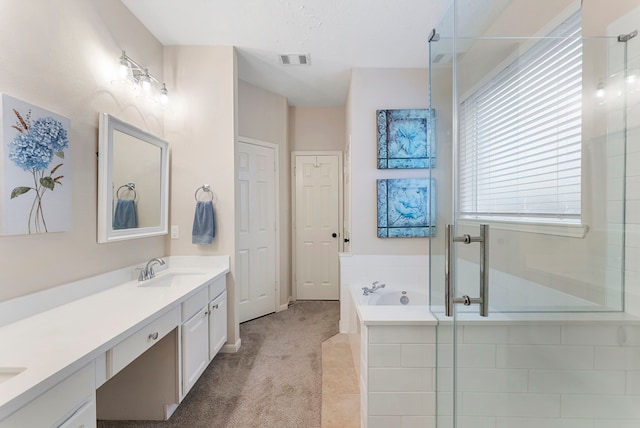 17131 Valley Palms Dr, Spring, TX 77379 - bathroom featuring double vanity, a bath, and a stall shower