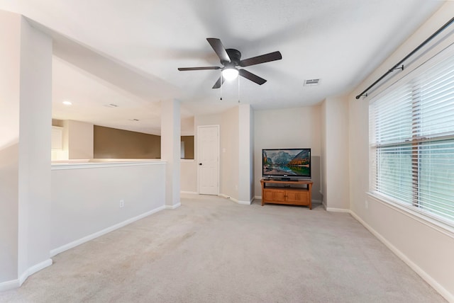 17131 Valley Palms Dr, Spring, TX 77379 - unfurnished living room with light carpet and a ceiling fan