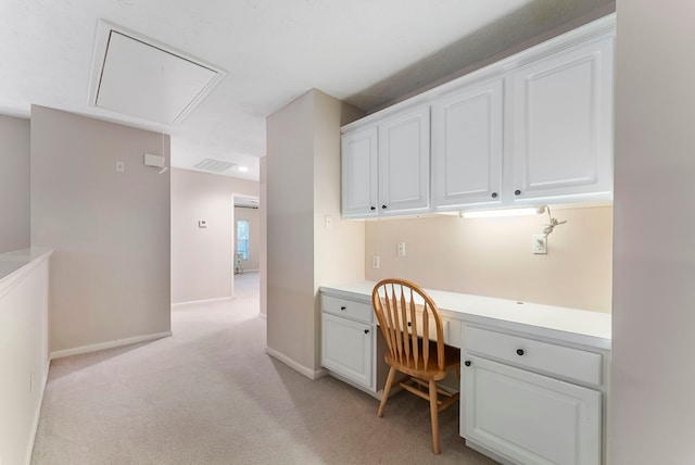 17131 Valley Palms Dr, Spring, TX 77379 - home office featuring attic access, built in desk, and light colored carpet