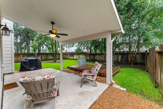 17131 Valley Palms Dr, Spring, TX 77379 - fenced backyard with ceiling fan, a grill, a patio area, and a deck