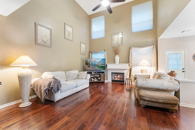 17131 Valley Palms Dr, Spring, TX 77379 - living area with hardwood / wood-style flooring, ceiling fan, a fireplace, and high vaulted ceiling