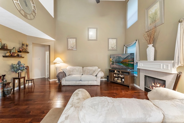 17131 Valley Palms Dr, Spring, TX 77379 - living room featuring hardwood / wood-style flooring, a fireplace, and a high ceiling