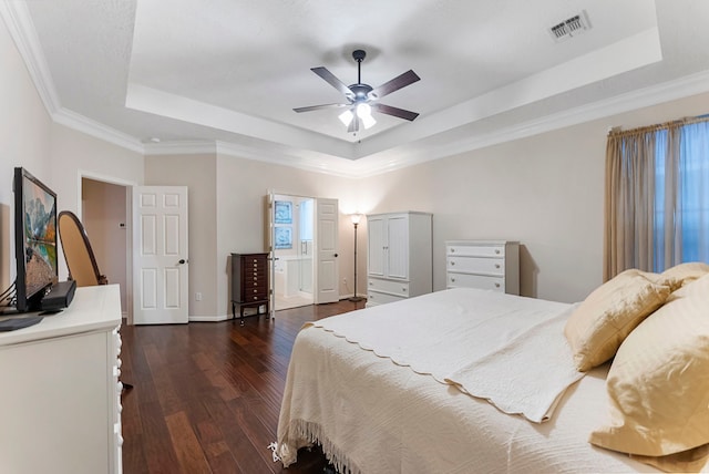 17131 Valley Palms Dr, Spring, TX 77379 - bedroom with a raised ceiling, dark wood-style flooring, crown molding, and a ceiling fan