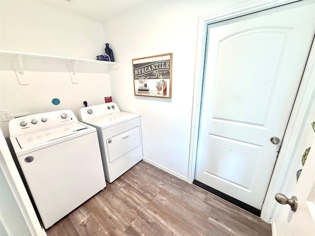 24446 Elmwood Falls Dr, Spring, TX 77373 - laundry area featuring washer and clothes dryer and light wood-type flooring