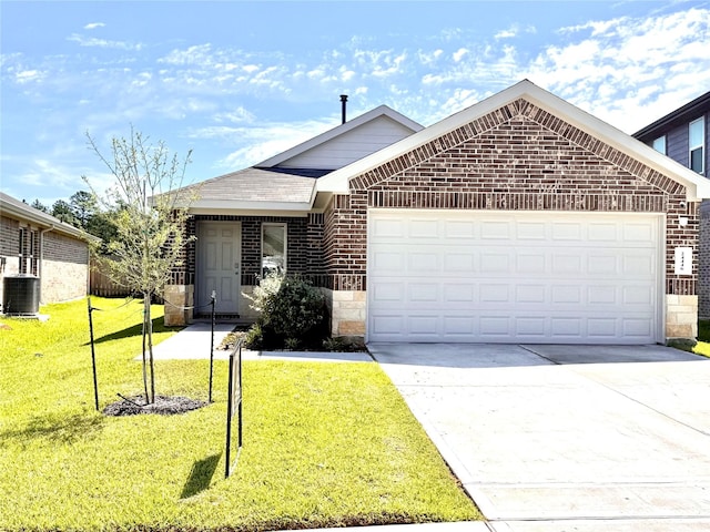 24446 Elmwood Falls Dr, Spring, TX 77373 - ranch-style house with brick siding, a garage, central AC, concrete driveway, and a front yard