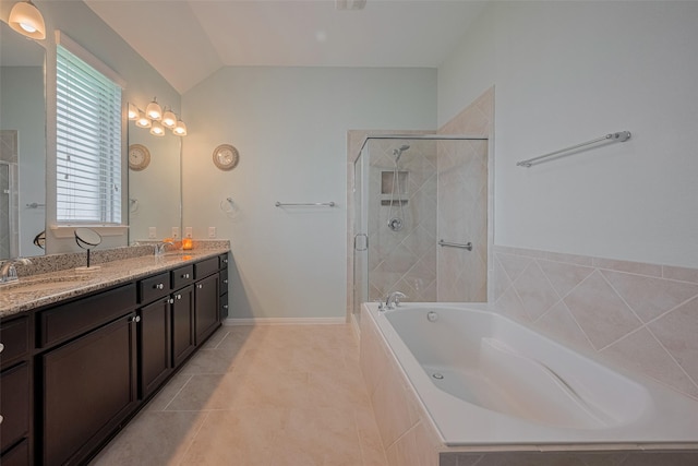 8107 Bosphorus St, Houston, TX 77044 - bathroom featuring a garden tub, a stall shower, double vanity, vaulted ceiling, and tile patterned floors