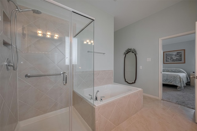 8107 Bosphorus St, Houston, TX 77044 - full bathroom with a shower stall, a garden tub, tile patterned floors, and ensuite bath