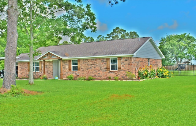 12207 Cherry Point Dr, Dayton, TX 77535 - ranch-style house with brick siding and roof with shingles