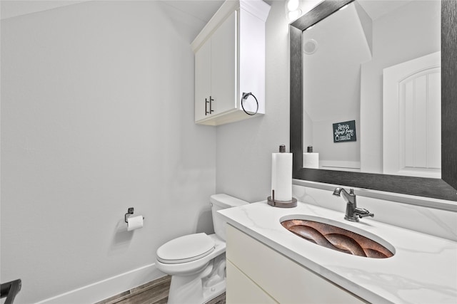 1420 Palomino Trl, Angleton, TX 77515 - half bath with wood finished floors, toilet, vanity, and baseboards