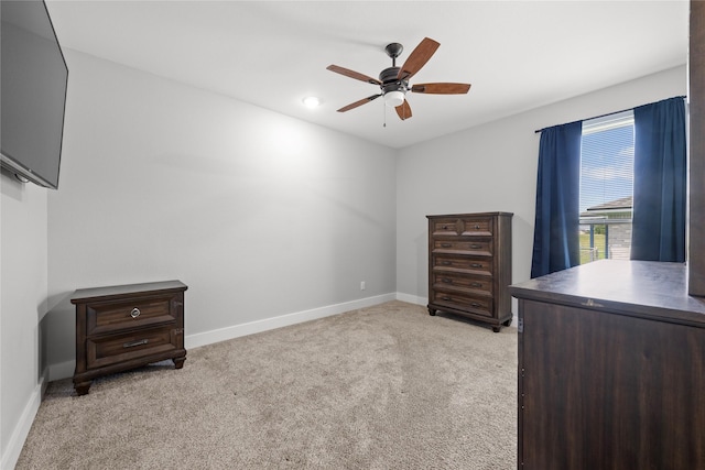 1420 Palomino Trl, Angleton, TX 77515 - unfurnished bedroom with baseboards, light colored carpet, and a ceiling fan