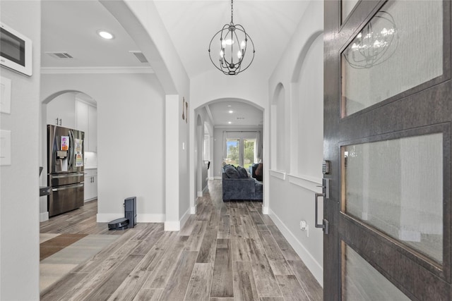 1420 Palomino Trl, Angleton, TX 77515 - entryway featuring recessed lighting, ornamental molding, a chandelier, light wood-style floors, and baseboards