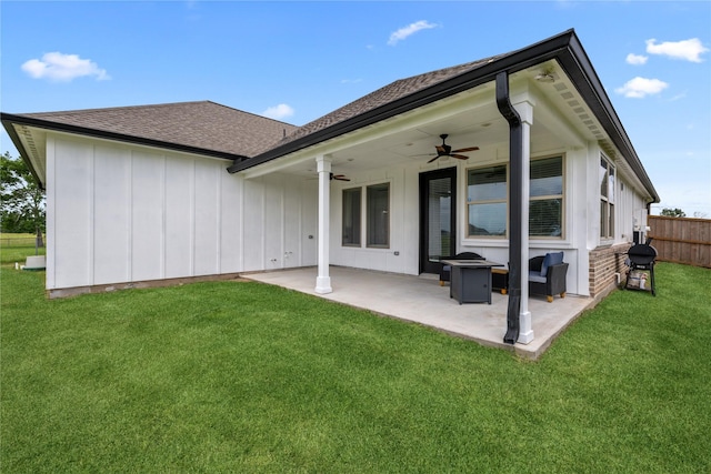 1420 Palomino Trl, Angleton, TX 77515 - back of house featuring ceiling fan, board and batten siding, a patio area, a shingled roof, and a fire pit