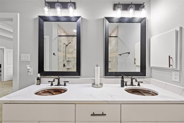 1420 Palomino Trl, Angleton, TX 77515 - bathroom featuring a tile shower and double vanity