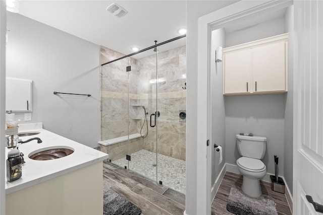 1420 Palomino Trl, Angleton, TX 77515 - full bathroom featuring a stall shower, toilet, wood finished floors, double vanity, and recessed lighting