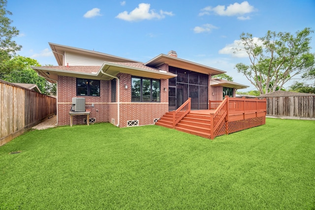 5311 Indigo St, Houston, TX 77096 - back of house featuring a sunroom, brick siding, a fenced backyard, and a chimney