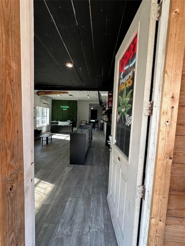 304 Lockwood Dr, Houston, TX 77011 - corridor featuring wood finished floors and a wall mounted AC
