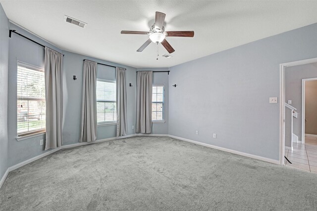 9807 Opal Rock Dr, Rosharon, TX 77583 - carpeted empty room with a ceiling fan and baseboards