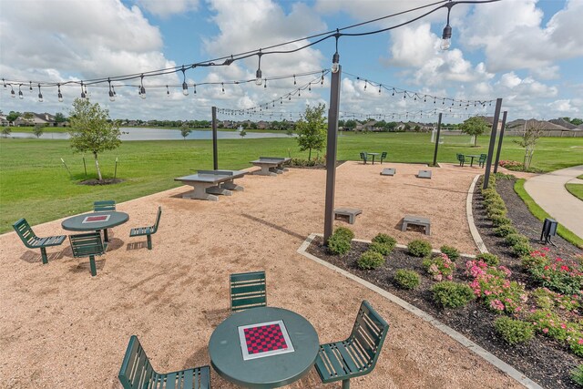 9807 Opal Rock Dr, Rosharon, TX 77583 - surrounding community with a yard and a water view