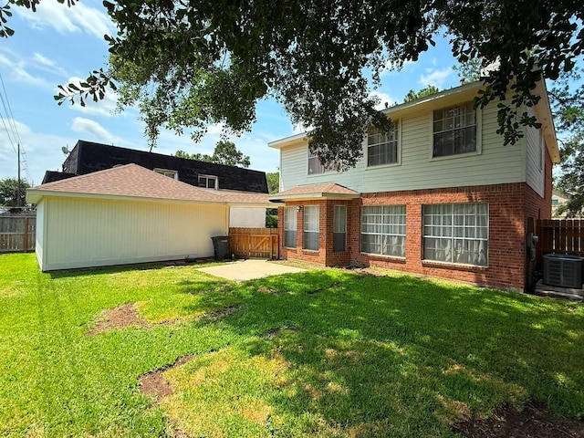 11442 Galbreath Dr, Houston, TX 77066 - back of property with cooling unit, brick siding, and a patio area