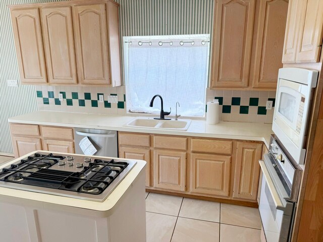 11442 Galbreath Dr, Houston, TX 77066 - kitchen featuring light brown cabinetry, a sink, appliances with stainless steel finishes, and light countertops