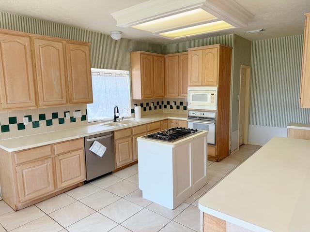 11442 Galbreath Dr, Houston, TX 77066 - kitchen with stainless steel appliances, light brown cabinetry, a sink, wallpapered walls, and tasteful backsplash