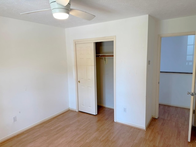 11442 Galbreath Dr, Houston, TX 77066 - unfurnished bedroom featuring light wood finished floors, a closet, baseboards, and a ceiling fan