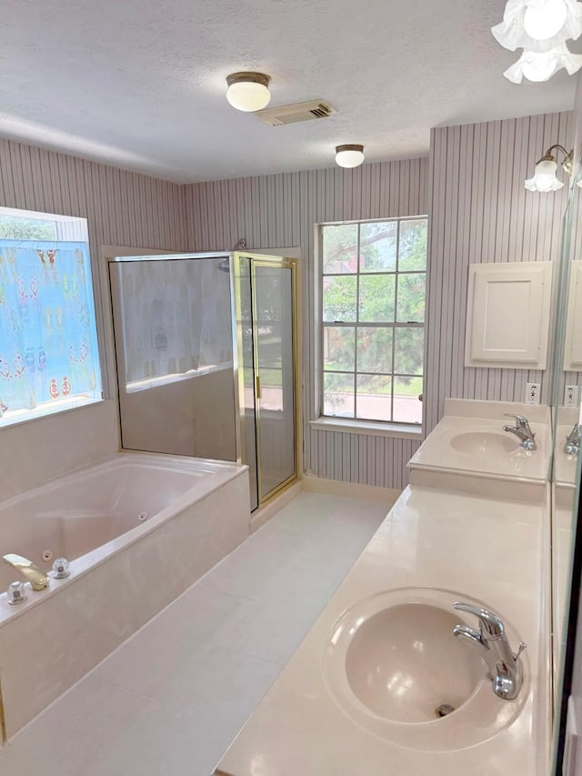 11442 Galbreath Dr, Houston, TX 77066 - bathroom with wallpapered walls, a shower stall, a whirlpool tub, double vanity, and tile patterned flooring