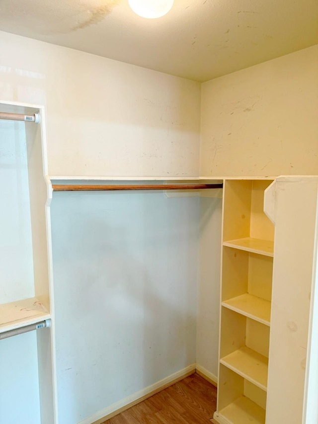 11442 Galbreath Dr, Houston, TX 77066 - walk in closet with wood finished floors