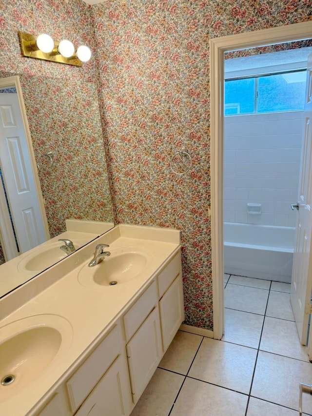11442 Galbreath Dr, Houston, TX 77066 - full bathroom featuring wallpapered walls, double vanity, tile patterned flooring, baseboards, and washtub / shower combination