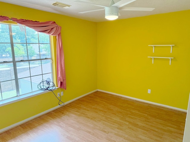 11442 Galbreath Dr, Houston, TX 77066 - unfurnished room with light wood-style floors, ceiling fan, and baseboards