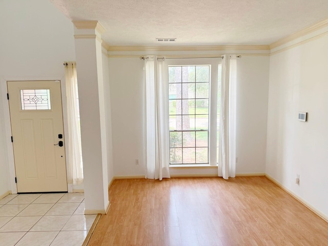 11442 Galbreath Dr, Houston, TX 77066 - foyer with light wood finished floors, baseboards, and crown molding