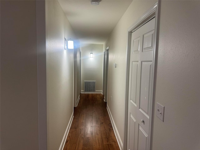 1412 Park Ln, Kilgore, TX 75662 - hallway featuring dark wood finished floors and baseboards