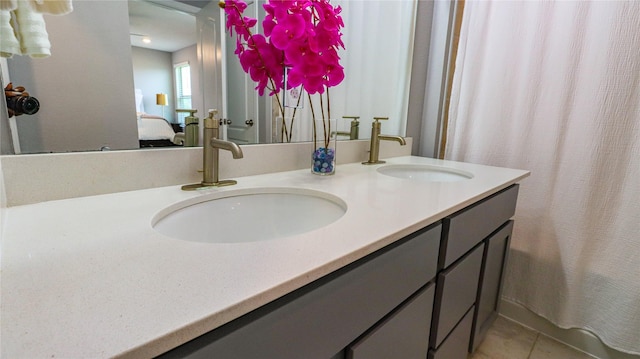 6005 Diamond Sky Ln, Houston, TX 77048 - ensuite bathroom featuring double vanity and tile patterned flooring
