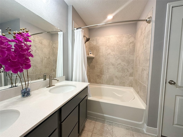 6005 Diamond Sky Ln, Houston, TX 77048 - bathroom featuring shower / bath combination with curtain, double vanity, and a textured ceiling