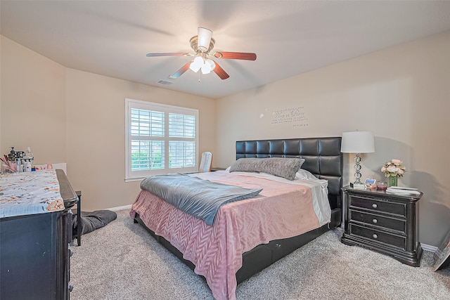 6623 Haven Forest Ln, Richmond, TX 77469 - carpeted bedroom with baseboards and ceiling fan