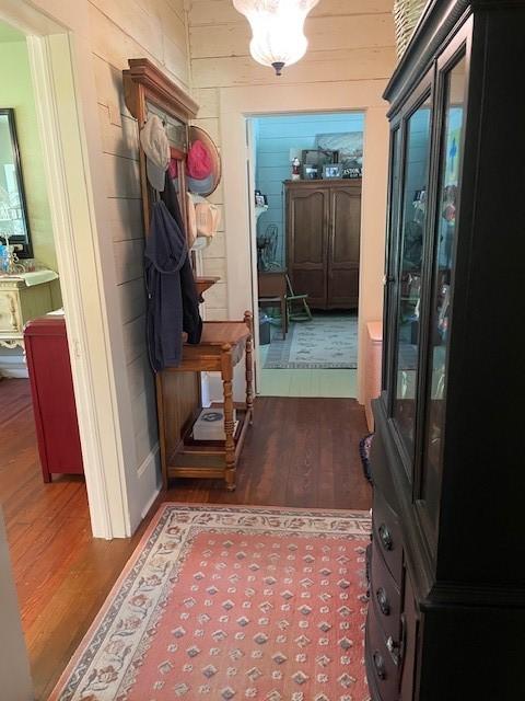 2114 E Lufkin Ave, Lufkin, TX 75901 - mudroom featuring dark wood-style floors and wooden walls
