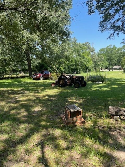 2114 E Lufkin Ave, Lufkin, TX 75901 - view of green lawn with view of scattered trees