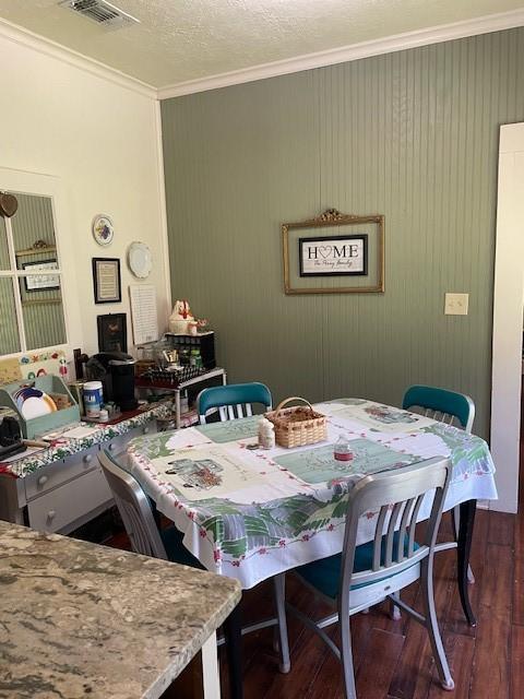 2114 E Lufkin Ave, Lufkin, TX 75901 - dining space with ornamental molding and dark wood-type flooring