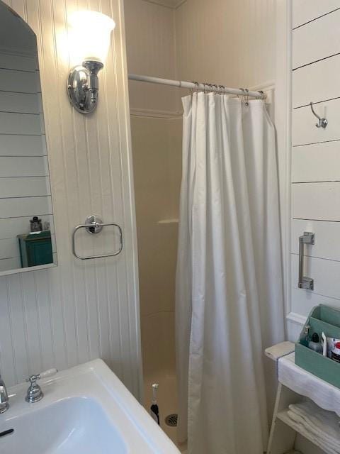 2114 E Lufkin Ave, Lufkin, TX 75901 - full bath with a stall shower and wood walls