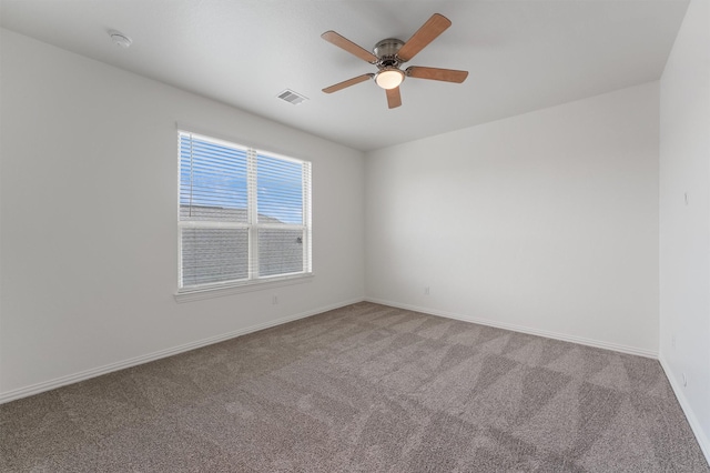 10091 Black Maple Dr, Conroe, TX 77385 - empty room with carpet flooring, a ceiling fan, baseboards, and a smoke detector